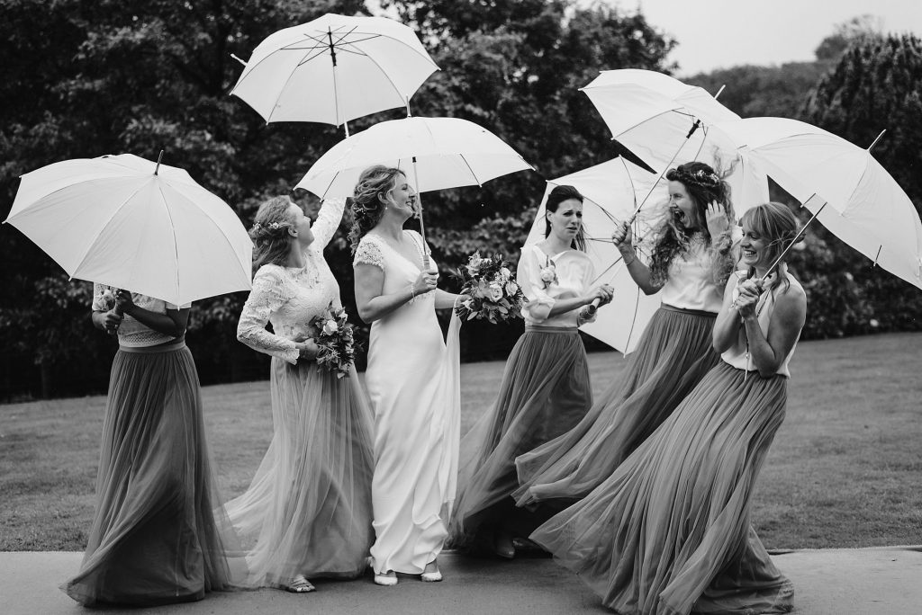 bridesmaids umbrella wedding photo