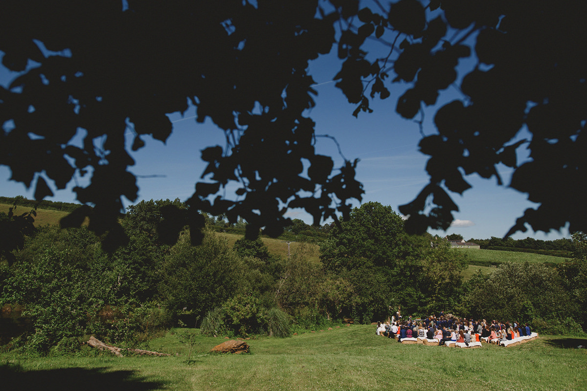 Outdoor wedding ceremony by lake