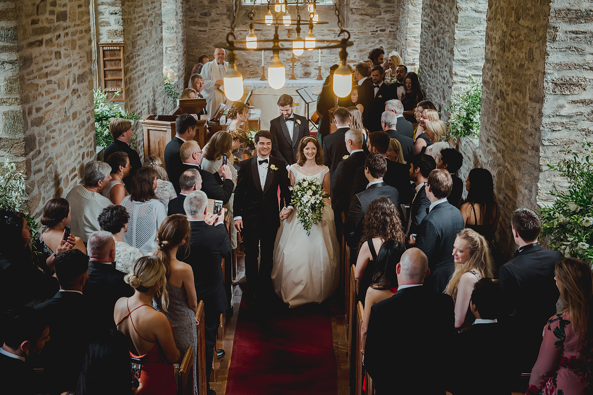 Bride and groom walking down the isle
