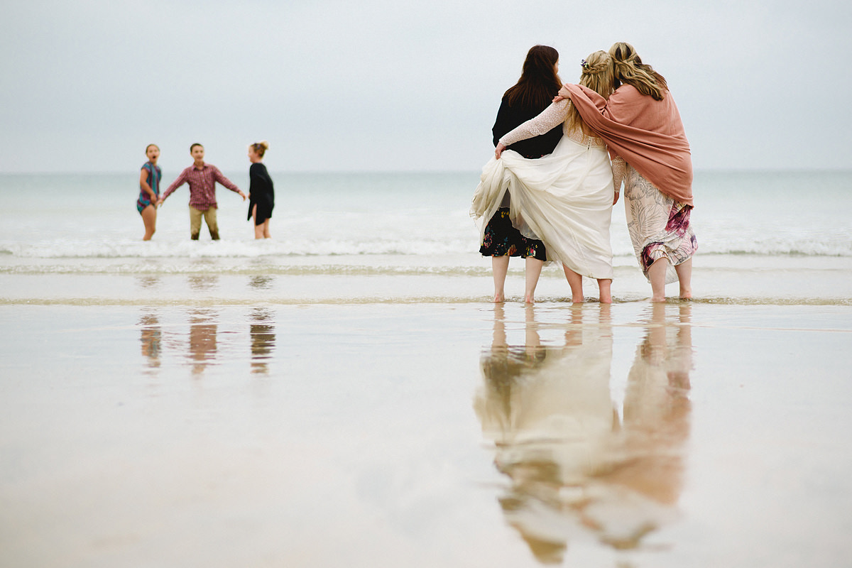 Bride and bridesmaids at Lusty Glaze beach